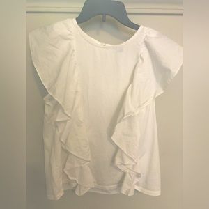 White sleeveless top with fringes. Button up in the back. Size M.